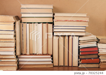 Heaps of various paper books 70325244