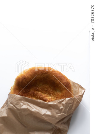 Lavash on a white table. Traditional Asian cuisine. Yeast-free baked goods. Waste-free paper packaging Lavash on a white table. Traditional Asian cuisine. Yeast-free baked goods. Waste-free paper packaging 70326370