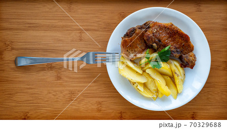 meat and potatoes white plate. close up. top view. meat and potatoes white plate. close up. top view. 70329688