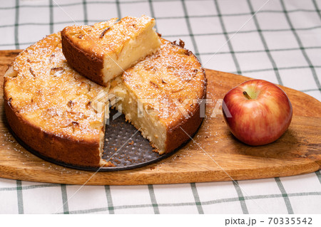 cut off part homemade cake and red Apple  70335542