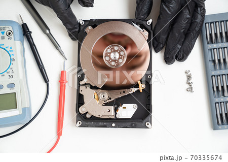 open Computer Hard Drive. screwdriver set. Hands. open Computer Hard Drive. screwdriver set. Hands. 70335674