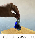 Male hand holding a keys Male hand holding a keys 70337711