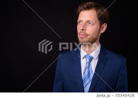 Face of bearded businessman in suit thinking Face of bearded businessman in suit thinking 70340426