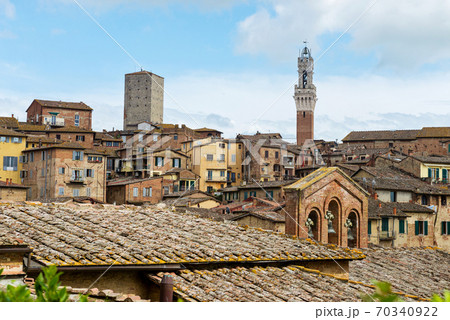 SIENA, ITALY - APRIL 26, 2019: View to the old town in Siena, Italy SIENA, ITALY - APRIL 26, 2019: View to the old town in Siena, Italy 70340922