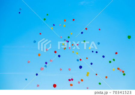 Many colorful balloons flying in the sky 70341523