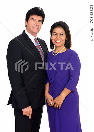 Studio shot of happy mature couple isolated against white background Studio shot of happy mature couple isolated against white background 70342823
