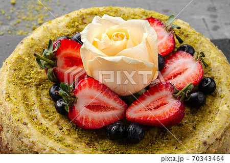 Pistachio cheesecake with berries and rose Pistachio cheesecake with berries and rose 70343464