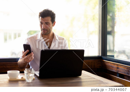 Portrait of handsome Turkish man relaxing at the coffee shop 70344007