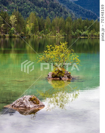 Lake Hintersee with rock and trees in the Berchtesgaden Alps, Germany Lake Hintersee with rock and trees in the Berchtesgaden Alps, Germany 70348169
