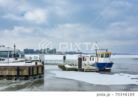 Winter time in the city port of Rostock, Germany Winter time in the city port of Rostock, Germany 70348189
