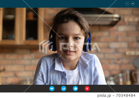Little boy child in headphones talk on video call 70348484