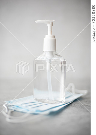 antiseptic hand gel in a transparent plastic bottle and mask antiseptic hand gel in a transparent plastic bottle and mask 70350880
