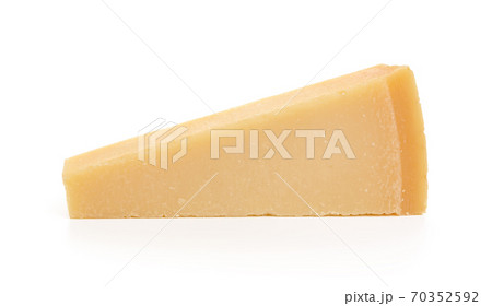 Wedge of italian hard cheese Grana Padano or Parmesan isolated on white background. Wedge of italian hard cheese Grana Padano or Parmesan isolated on white background. 70352592