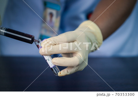 Close up of doctor hand holding blood sample test . Medical concept image 70353300