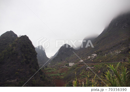 Cinematic landscape scenery of mountains in Dong Van Karst Plateau Geopark in Sa phin, Vietnam 70356390