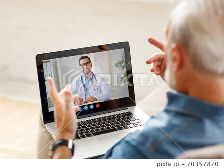 Senior man speaking with online doctor. Senior man speaking with online doctor. 70357870