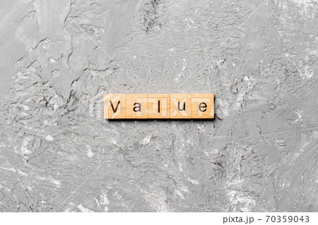 value word written on wood block. value text on table, concept 70359043