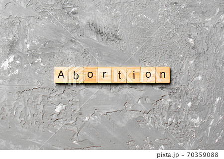 abortion word written on wood block. abortion text on table, concept 70359088
