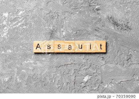 assault word written on wood block. assault text on table, concept assault word written on wood block. assault text on table, concept 70359090