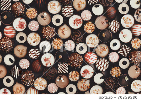 Toned image of various chocolate candies, sweet confectionary collection, dessert vintage background Toned image of various chocolate candies, sweet confectionary collection, dessert vintage background 70359580