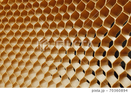 honeycomb cells of cardboard stiffening rib background 70360894