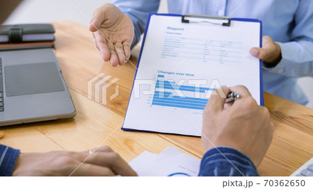 Business Corporate meeting using laptop at conference table discussing ideas for their business project in modern office. Business Corporate meeting using laptop at conference table discussing ideas for their business project in modern office. 70362650