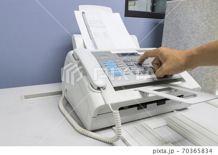 The fax machine use for Sending documents in the office, concept equipment needed in office 70365834