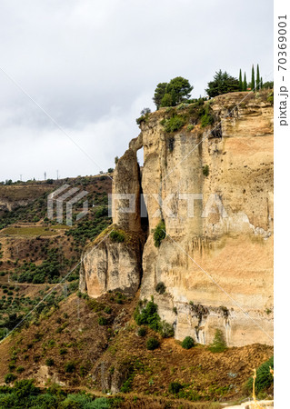 Scenic sight of Ronda with white houses built on high cliffs, Andalusia, Spain. 70369001