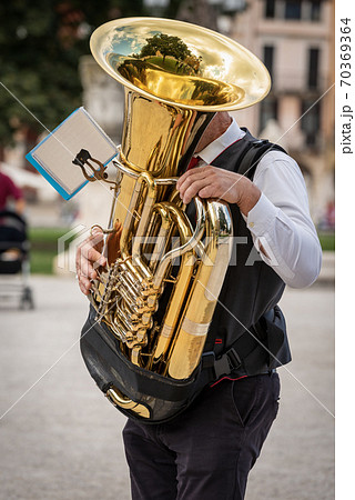 Musician of a Brass Band plays a Tuba - Padua Italy 70369364