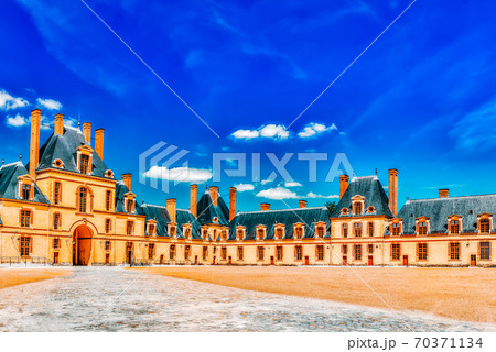 FONTAINEBLEAU, FRANCE - JULY 09, 2016 :Suburban Residence of the France Kings - beautiful Chateau Fontainebleau and surrounding his park. FONTAINEBLEAU, FRANCE - JULY 09, 2016 :Suburban Residence of the France Kings - beautiful Chateau Fontainebleau and surrounding his park. 70371134