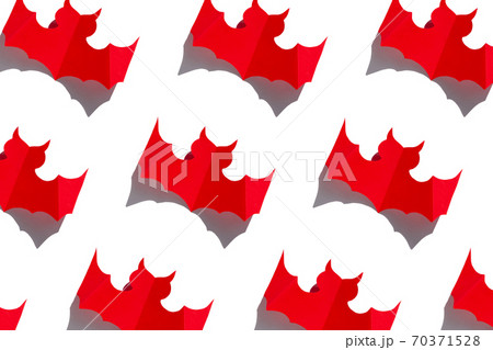 Halloween holiday background red paper bat with hard shadow on white background. Creative minimalism style greeting card Halloween holiday background red paper bat with hard shadow on white background. Creative minimalism style greeting card 70371528