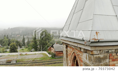 Piece of chapel building in the foreground. 70373042