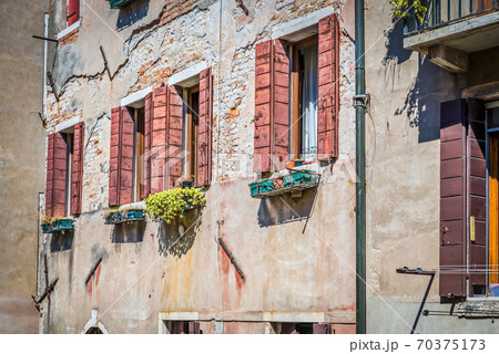 Typical window in a house in old Europe Typical window in a house in old Europe 70375173