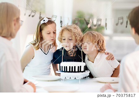 Music and piano birthday party. Kid with cake. Music and piano birthday party. Kid with cake. 70375817