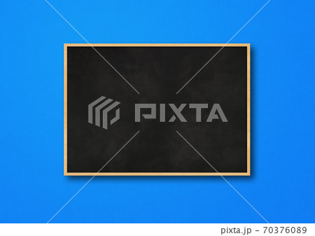 Traditional black board isolated on a blue background 70376089