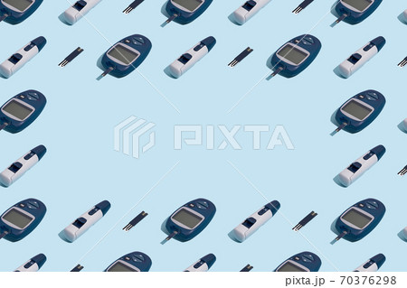 Glucose meter and pen on blue background with shadow, Metabolic syndrome concept 70376298