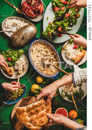 Flat-lay of people having Turkish style dinner Flat-lay of people having Turkish style dinner 70377541