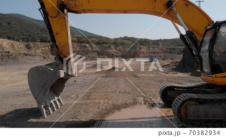 Earthmoving machine for excavation and dumping. 70382934