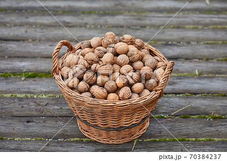 Walnuts in a basket Walnuts in a basket 70384237