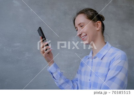 Woman using smartphone, having video chat, interview or consultation Woman using smartphone, having video chat, interview or consultation 70385515