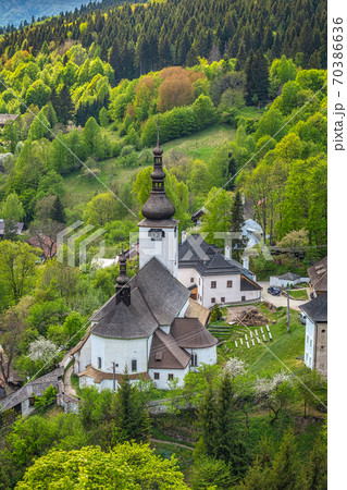 Church in The Spania Dolina village with surrounding landscape, 70386636