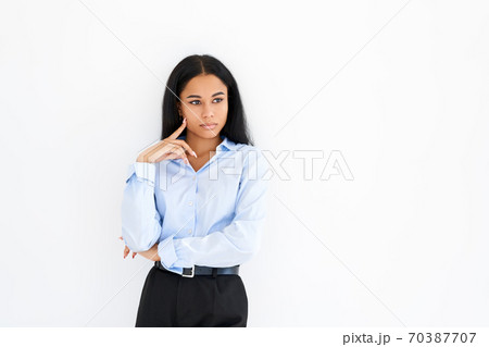 Thoughtful african american businesswoman posing on white background Thoughtful african american businesswoman posing on white background 70387707
