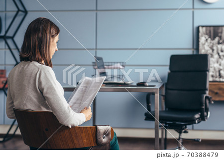 Woman with a CV sits and waits for the interview to begin 70388479