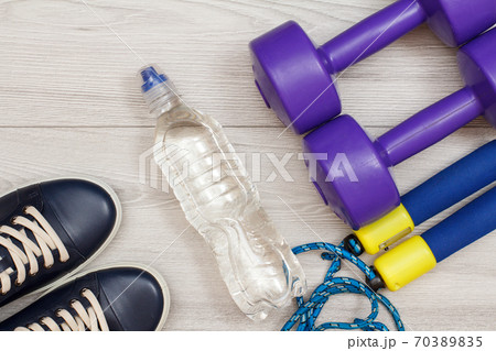 Different tools for fitness on floor in room Different tools for fitness on floor in room 70389835
