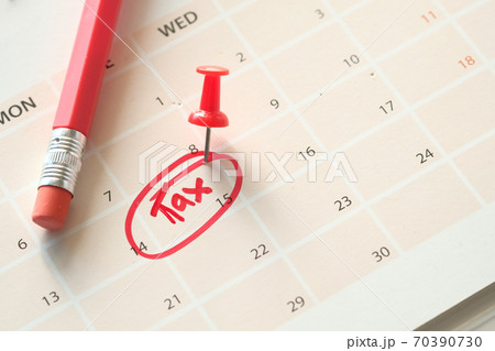 tax day concept with red circle on calendar date tax day concept with red circle on calendar date 70390730