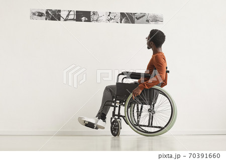 Minimal Portrait of Handicapped Man Visiting Art Museum 70391660