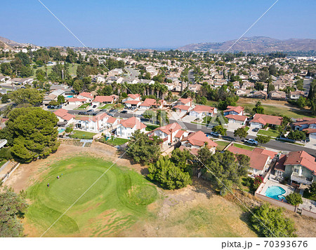 Aerial view of Southern California houses surrounded by golf in inland town Corona 70393676