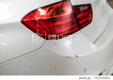 The taillight of the car with a scratch. Close-up The taillight of the car with a scratch. Close-up 70393801