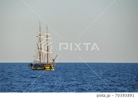 Old vessel sail ship in open sea Old vessel sail ship in open sea 70393891