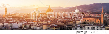 Front of real plane aircraft, on Florence Cityscape in Sunrise at Florence, Italy background 70398820